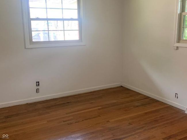 Main bedroom with hardwood flooring | Image 8