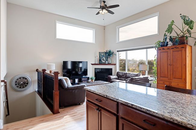 Open concept with great flow from kitchen to living to dining. Huge windows and soaring ceilings let in all the natural light. | Image 8