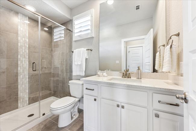 Adjoing full bath in the hallway has a walk in shower. | Image 36