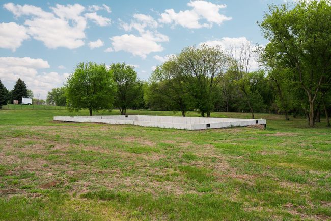 There is a foundation ready for a home if desired | Image 4