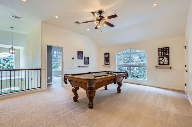 Spacious game room featuring a pool table and room to spare. | Image 18
