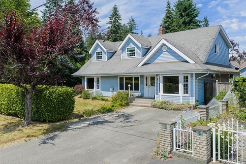 Amazing rare Cape Cod style home and massive 10, 865sf corner lot. | Card Image