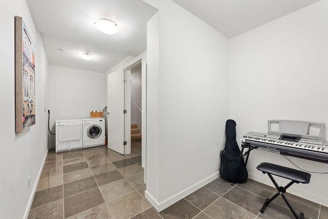 Laundry area and Den. | Image 32