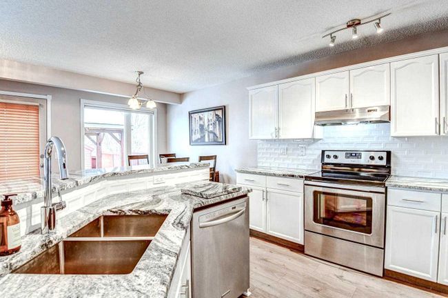 116 Bridlewood Circle Sw, Home with 3 bedrooms, 3 bathrooms and 4 parking in Calgary AB | Image 2
