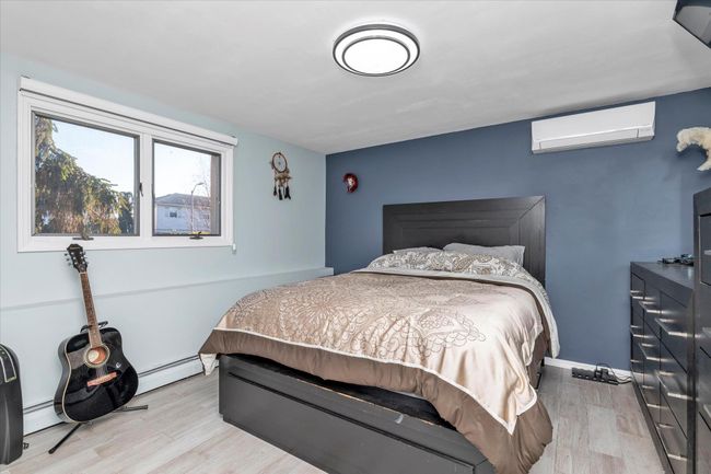 Bedroom with wood finished floors | Image 10