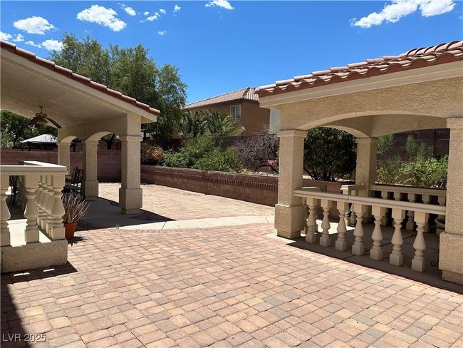 View of patio / terrace featuring fence and a ceiling fan | Image 31
