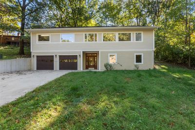 View of front of home with a front lawn and a garage | Image 2