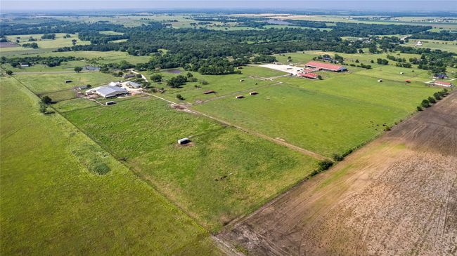 Aerial view of sparsely populated area with a pastoral area | Image 30