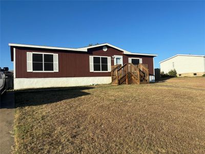 Rear view of house with a lawn | Image 2