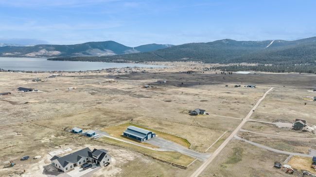 Bird's eye view featuring a water and mountain view | Image 15