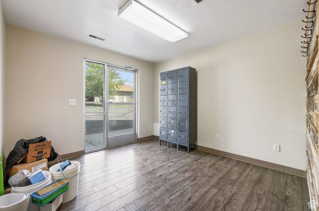 Spare room featuring wood finished floors and baseboards | Image 9