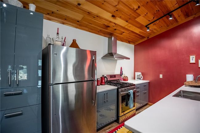Kitchen, propane gas stove, stainless refrigerator | Image 12