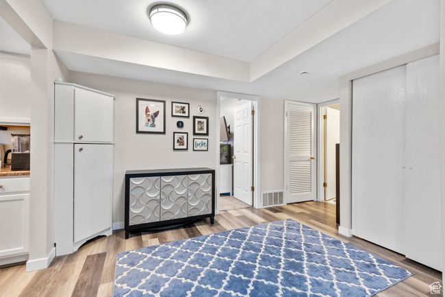 Bedroom with light wood finished floors and baseboards | Image 12