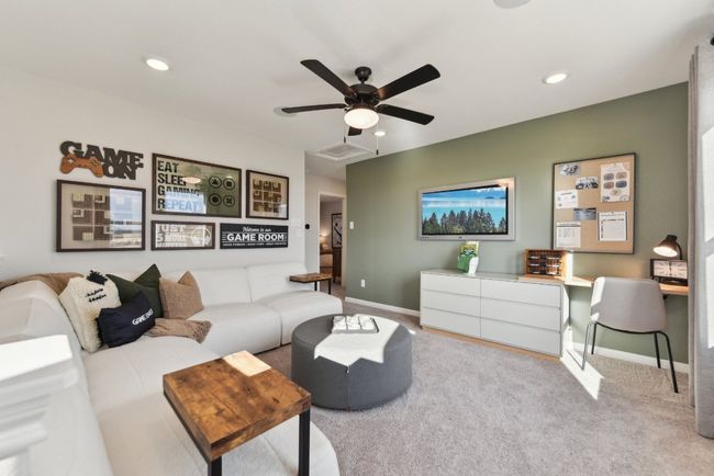 Living room with a ceiling fan, baseboards, carpet floors, and recessed lighting | Image 10
