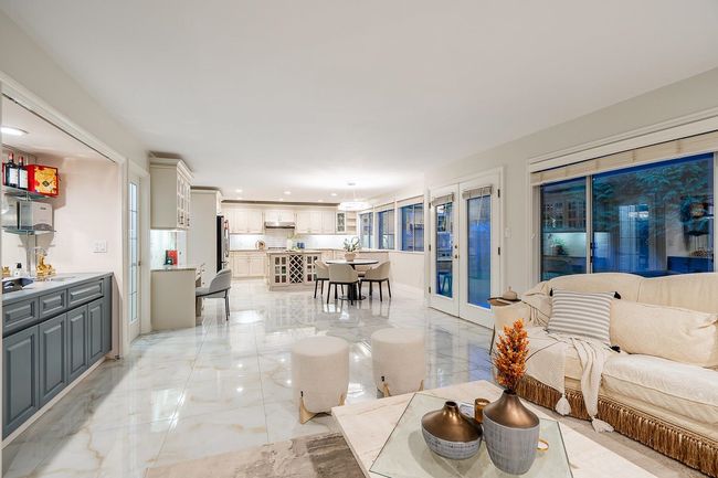Living area with light marble finish flooring and recessed lighting | Image 14