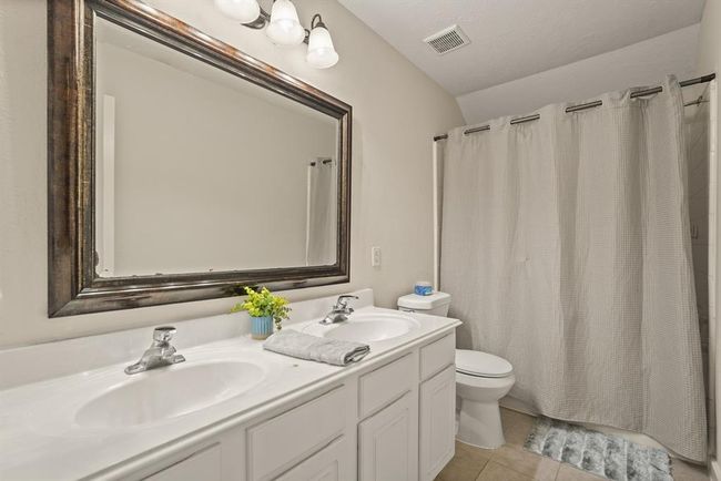 Spacious upstairs bathroom featuring double sinks. | Image 18