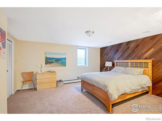 Bedroom 6 on lower level with egress window | Image 31