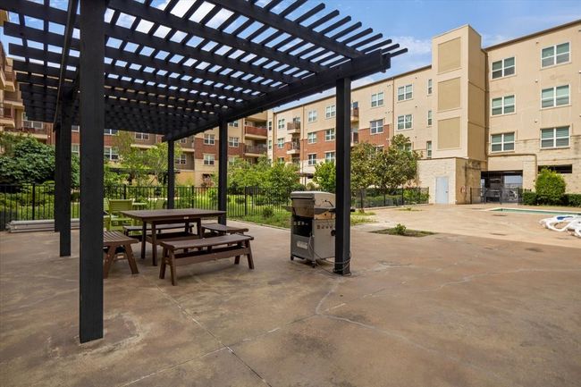 View of home's community featuring a pergola and a patio | Image 16