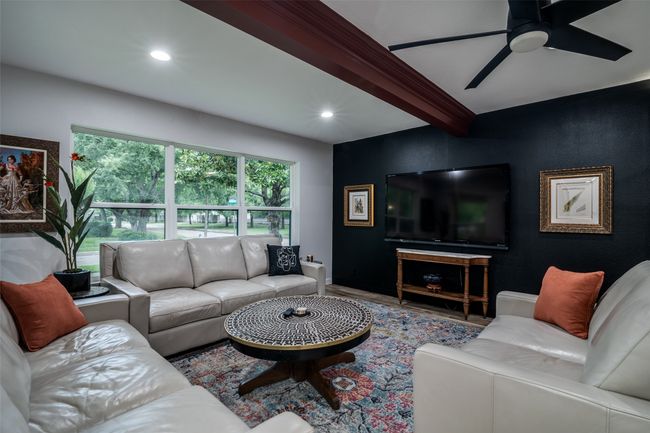 Living room featuring recessed lighting, beam ceiling, a ceiling fan, and wood finished floors | Image 6