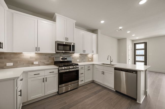 With the kitchen open to the dining and family rooms, the chef in the family will never be left out of the party! | Image 9