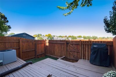 Relax in the fenced in yard with gate to open space | Image 3