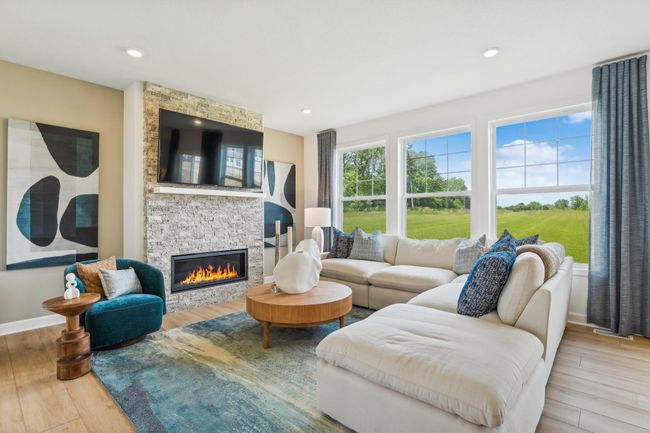 Photo is of the actual model. Cozy up next to the fireplace! | Image 5