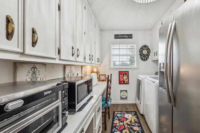 Kitchen with kitchen island | Image 17