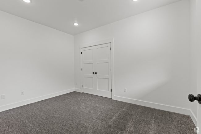 Spare room with dark colored carpet, recessed lighting, and baseboards | Image 24