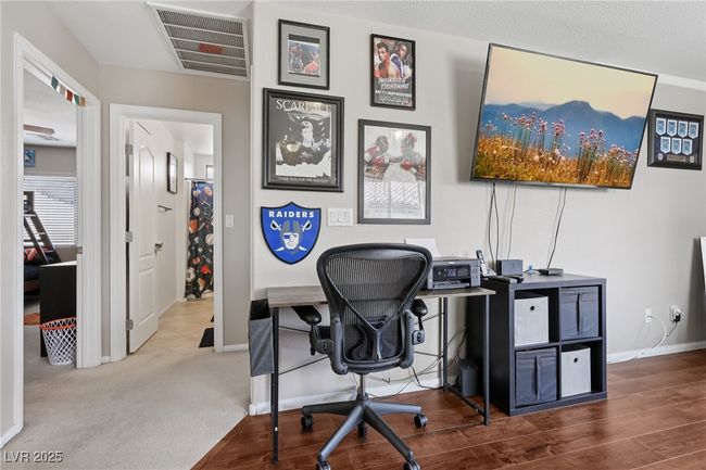 Home office featuring baseboards and wood finished floors | Image 37