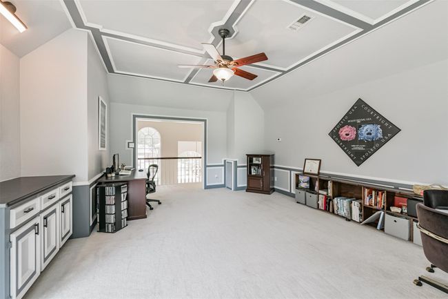 Game Room boasts built-in cabinets/storage, and architecturally appealing wood trim and colors | Image 33
