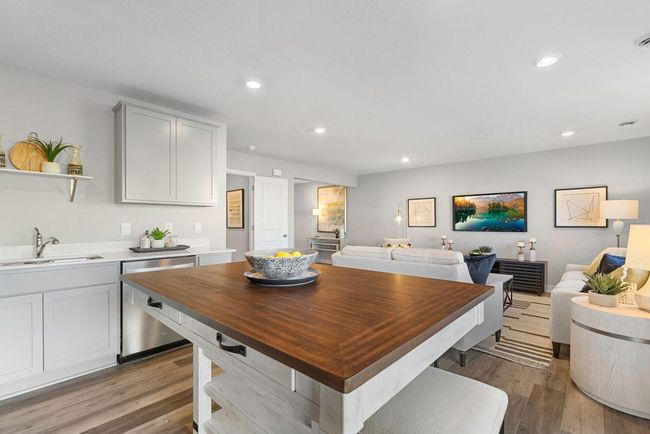 Open concept living with many ways to arrange furniture. Photo is of model home. Colors and options may vary. Ask Sales Agent for details. | Image 9
