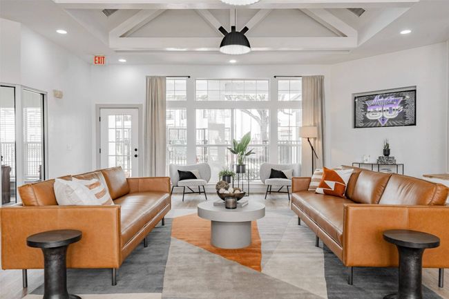 Living room with beam ceiling, a wealth of natural light, and wood-type flooring | Image 39