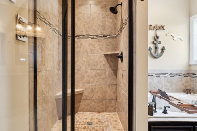 The stand-alone glass shower adds a sleek, modern touch to the space. 1107 Sycamore Leaf Way Murfreesboro, TN 37129 | Image 21