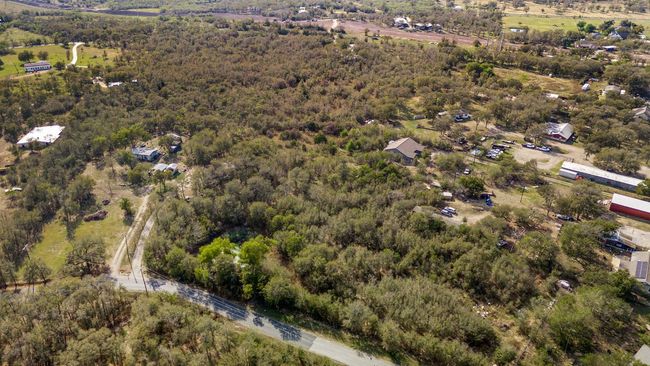 Aerial view of property and surrounding area featuring a heavily wooded area | Image 20