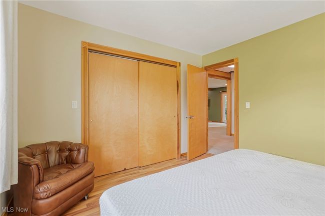 Bedroom with light wood finished floors and a closet | Image 28