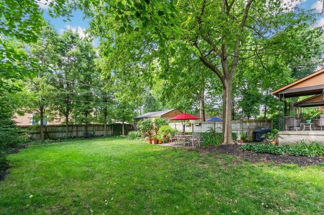 View of the fenced yard with double lot for unit 831 | Image 6