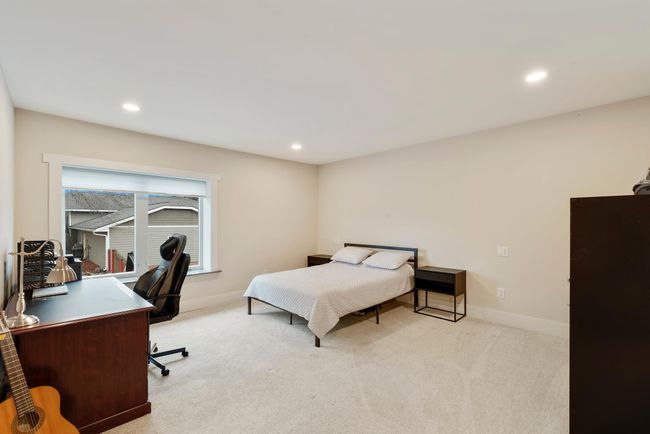 Second upstairs bedroom is equally impressive with it's large size and it's own ensuite bathroom & walk-in closet | Image 27