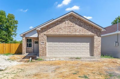 View of front of house featuring a garage | Image 1