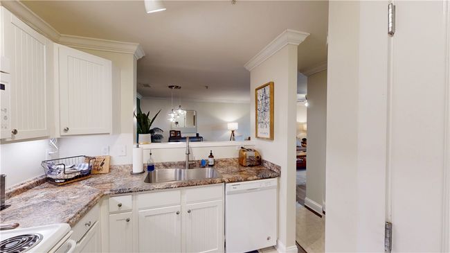Kitchen with opening to dining room | Image 6