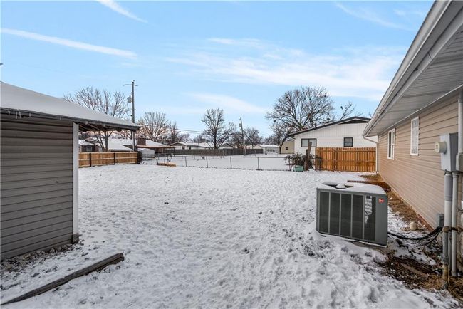 Yard covered in snow featuring central AC | Image 50