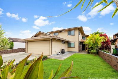 Exterior view of home with enhanced view of front yard. | Image 1