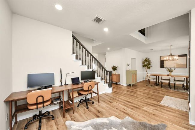 Just to the left as you enter, this bright and open flex space offers endless possibilities. Filled with natural light, it easily adapts to whatever you need—whether that’s a cozy sitting area, a home office, or a playful game room. It’s a versatile spot designed to fit any lifestyle. | Image 8