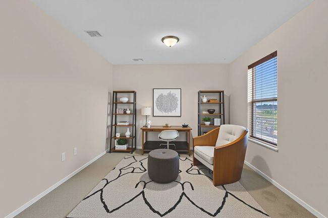 *VIRTURAL staged Extension of primary room as office area with carpet and baseboards | Image 27