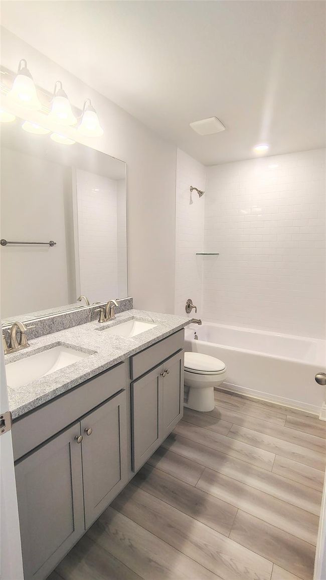 Stock Photo Secondary Bathroom with Dual Sinks | Image 16