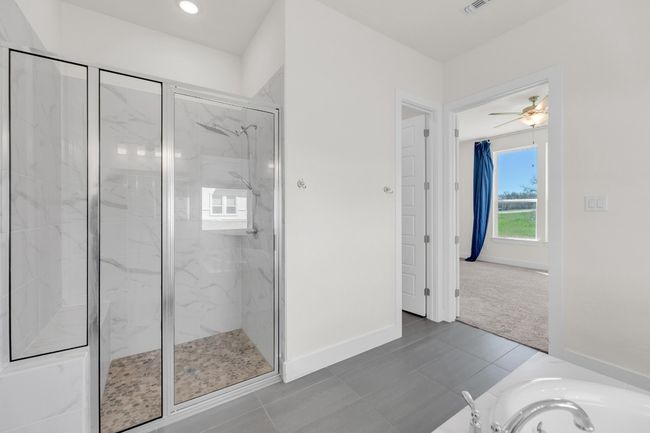 Bathroom with recessed lighting, a marble finish shower, a bathtub, and baseboards | Image 22