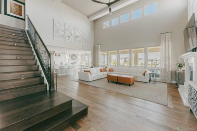 Multiple layers of windows paired with a ceiling reaching 20 feet into the air create a deluge of natural light saturating the living space. | Image 2