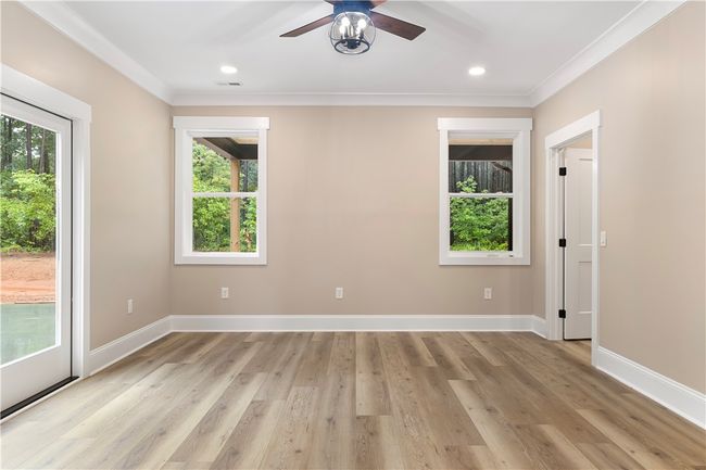 Master bedroom with exterior access to a patio. | Image 21