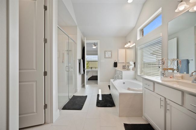 Full bathroom with a stall shower, a bath, vanity, tile patterned floors, and connected bathroom | Image 26