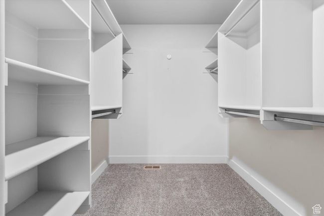 Walk in closet with carpet flooring | Image 23