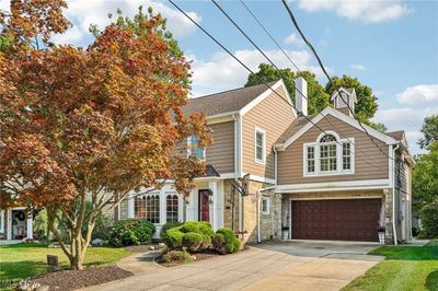 View of front of property with a front yard and a garage | Image 2